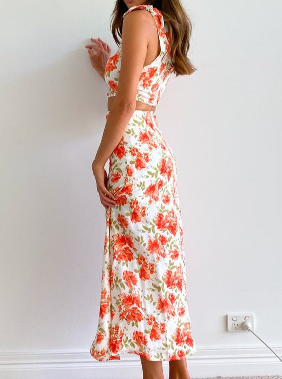 Mouwloze midi-jurk met bloemenprint en open taille 