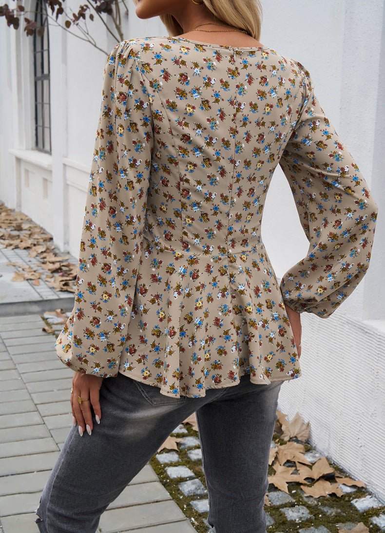 Blouse met lange mouwen en bloemenmotief en peplum